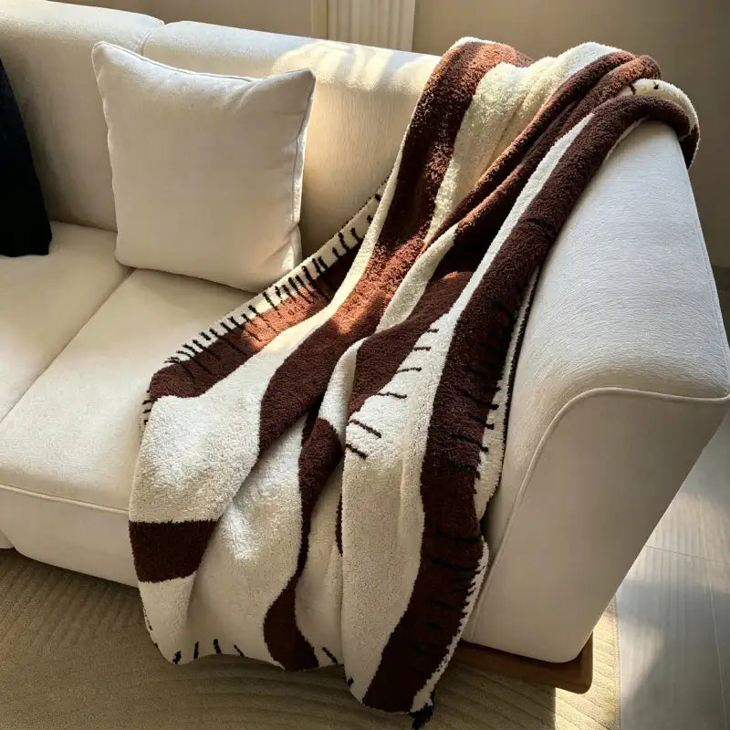 Kuscheldecke – warme Wohlfühlmomente im Wohnzimmer