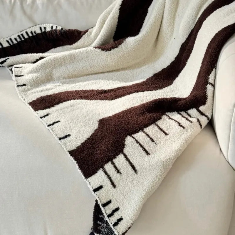Kuscheldecke – warme Wohlfühlmomente im Wohnzimmer